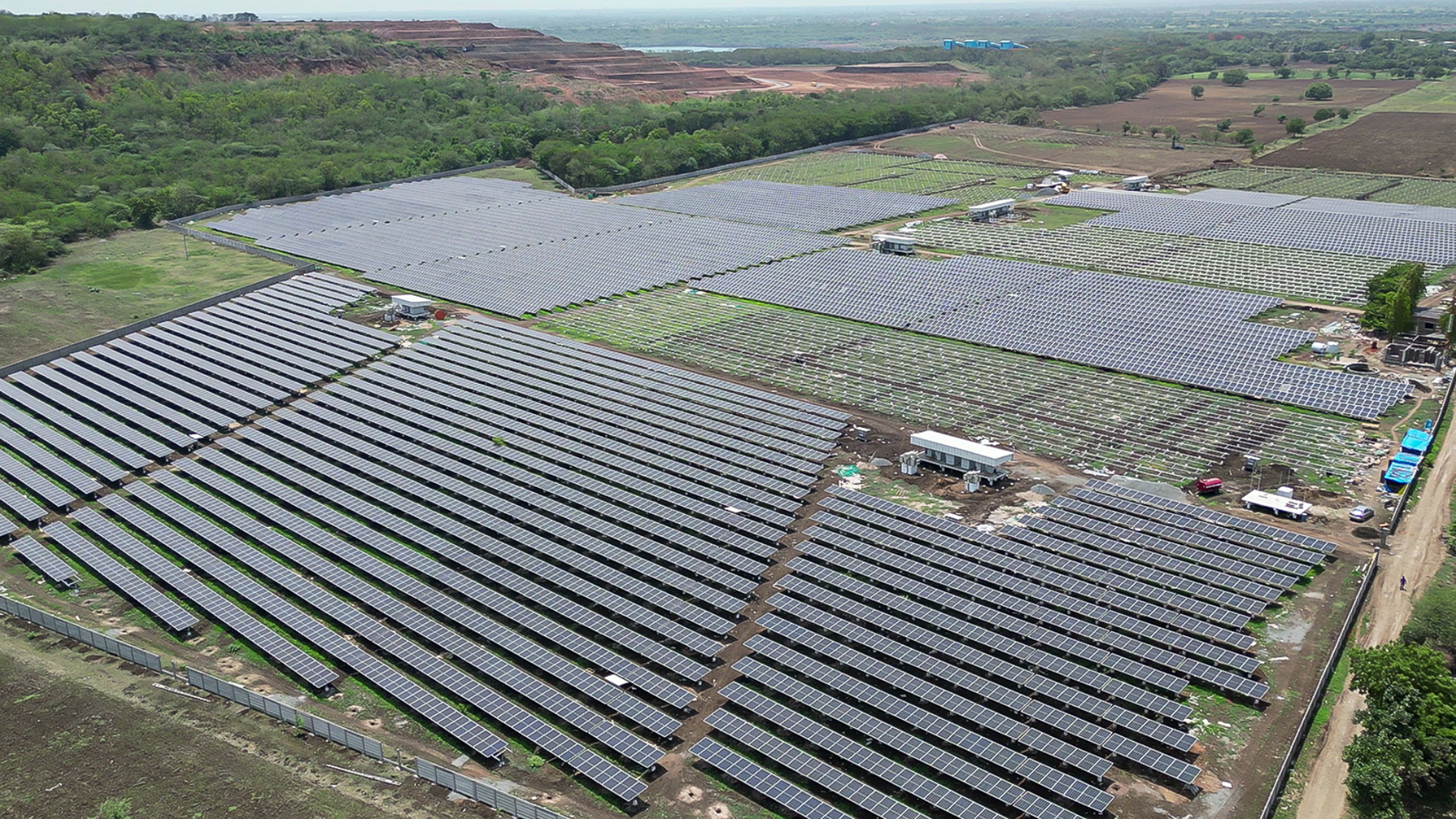 Aerial shot of Rayzon Solar Park 4 in Velachha with extensive ground-mounted solar panels.